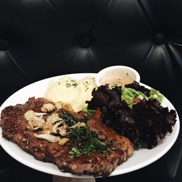 Rib-eye Steak - served with a side of salad and mashed potatoes