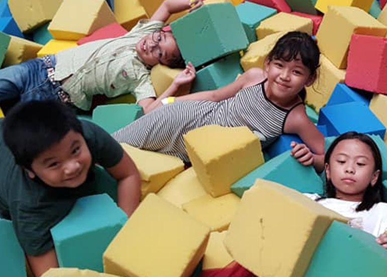 kids playing in foam Trampoline Park