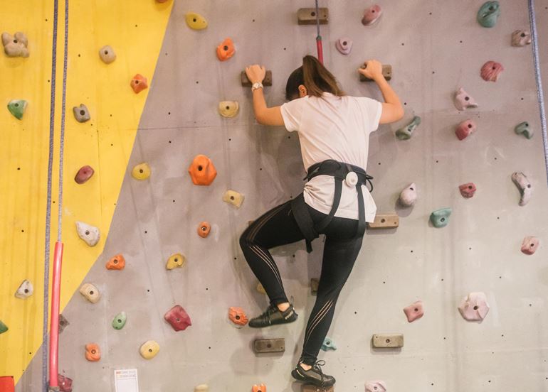 woman-climbing-power-up-indoor-wall