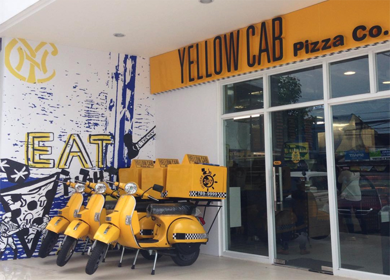 Yellow Cab Delivery Motorcycles in front of the establishment