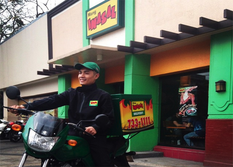 Mang Inasal Delivery Man in front of the establishment