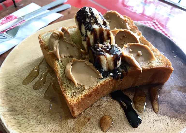 Peanut Butter Toast with Honey, Chocolate Syrup and Banana from Cafe Minou