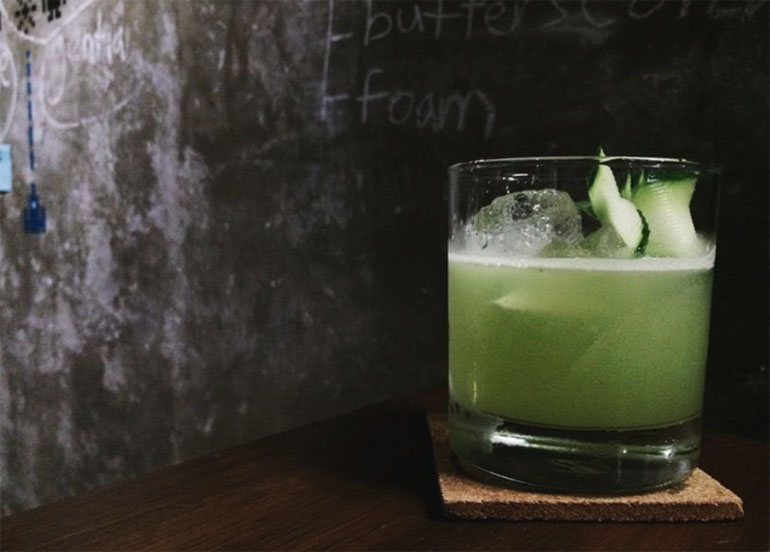 Green Gin with Cucumber garnish