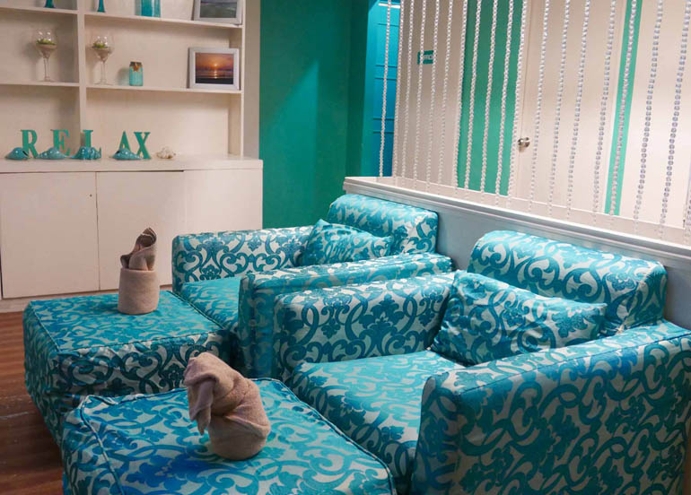 Nail Cocktales Interior featuring blue couches