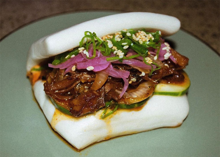 Pulled Pork Bao with Gochujang sauce, seaweed, and pickled onion from Dulo MNL