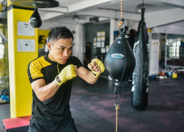 Guy Punching Speed Bag