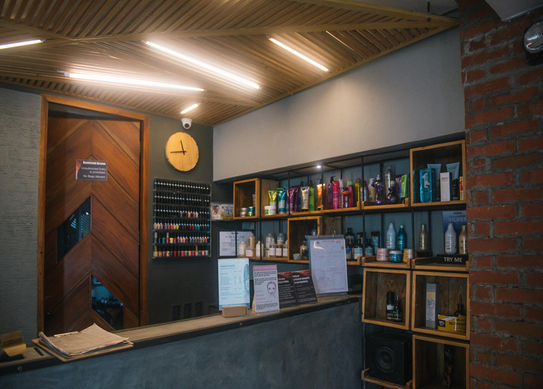 Azta Urban Salon Interior featuring an assortment of hair product and reception area