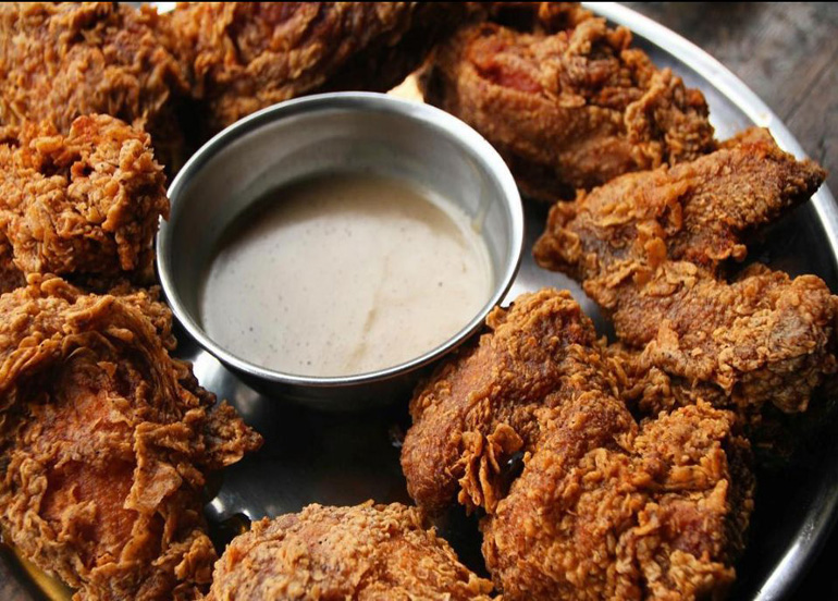 Senor Pollo Fried Chicken platter with gravy in the center