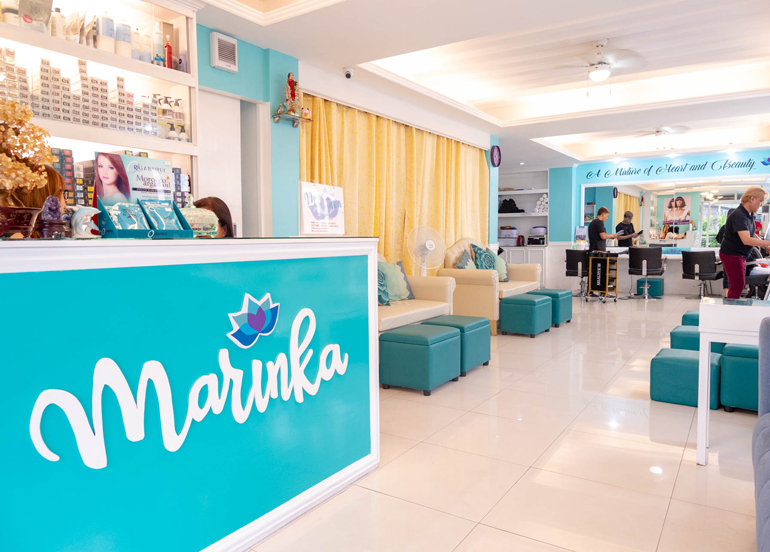Marinka Interior featuring logo, reception area, and chairs