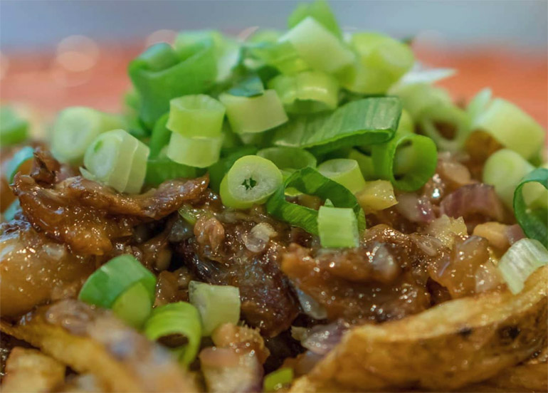 Beef topped with scallions