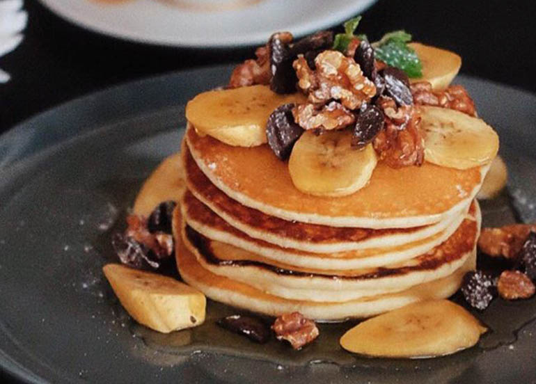 Pancakes with Banana, Walnuts, and Maple Syrup from Bondi & Bourke