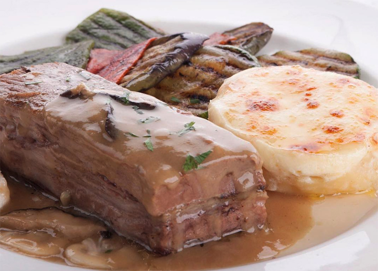 Bizu's Ten-Hour Roasted Angus Beef Belly with potato gratin, grilled vegetables, horse radish