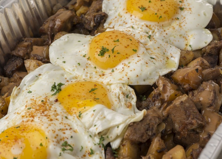 Kettle's Angus Roast Beef Hash topped with sunny-side-up eggs