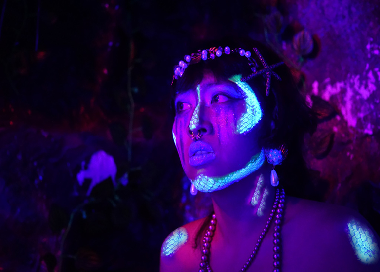 Tipsy Tales Folklore Character under Black Light