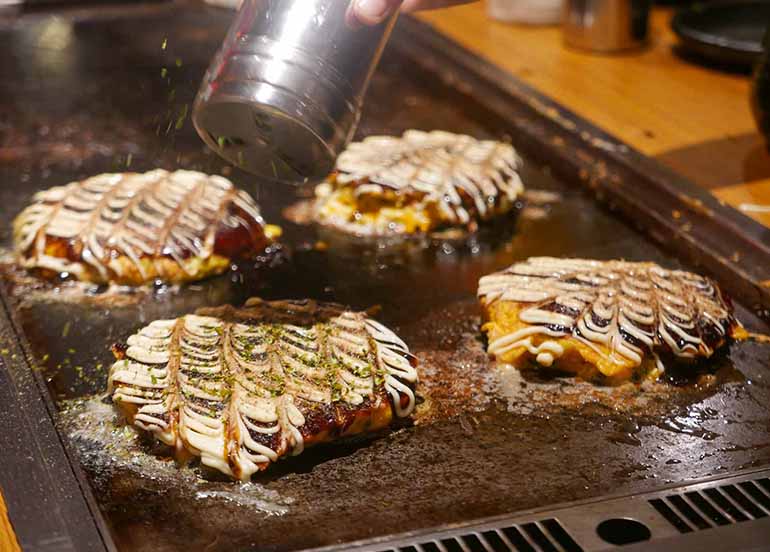 Okonomiyaki Being Cooked at Dohtonbori