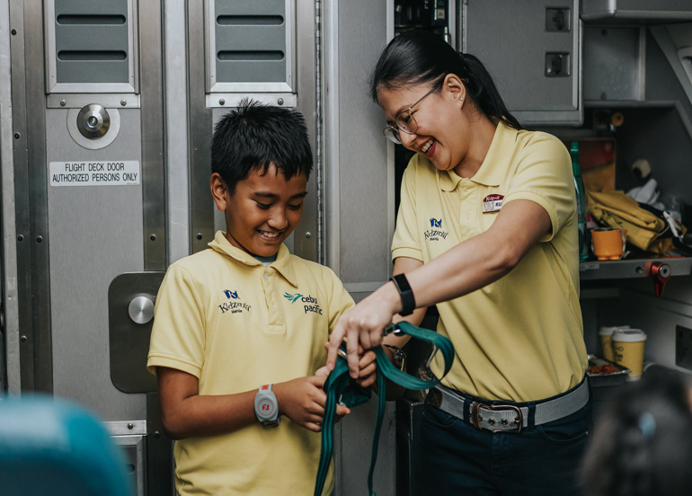 Young boy as flight attendant