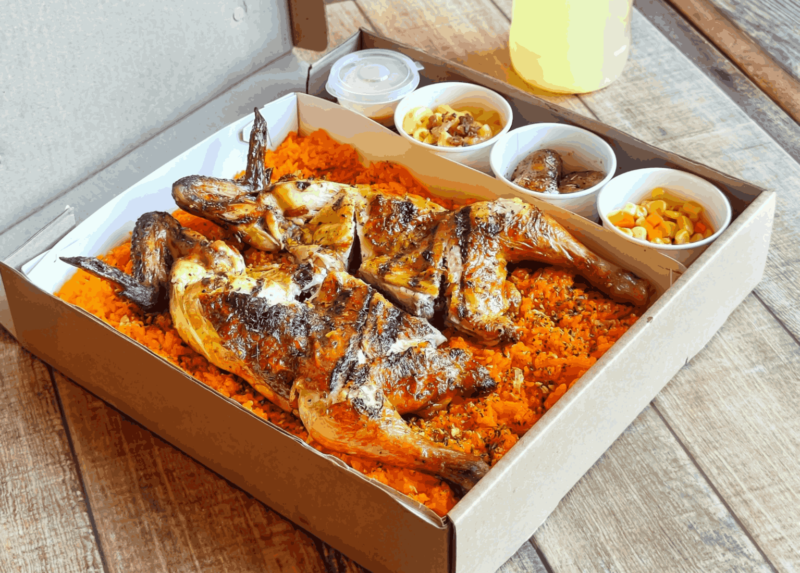 chicken and rice in a box from Peri-Peri Charcoal Chicken & Sauce Bar