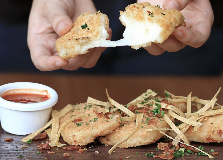 Denny's Mozzarella cheese sticks split in half 