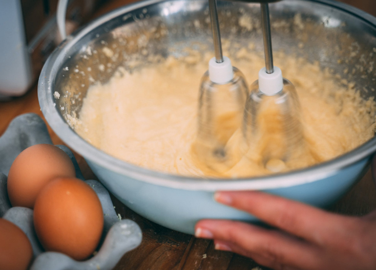 Photo of person beating eggs