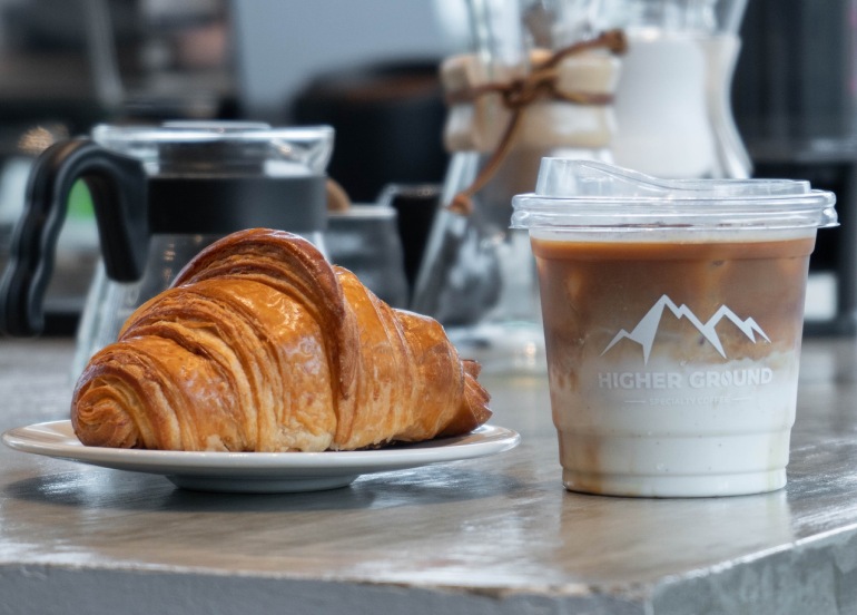 higher ground specialty coffee croissant and latte